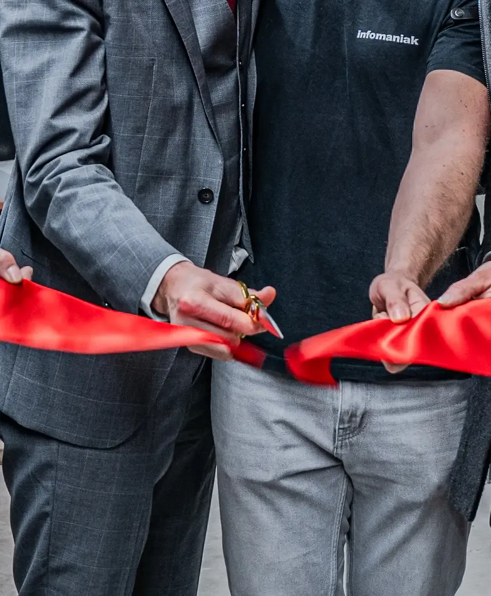 Image of a red ribbon cut with scissors