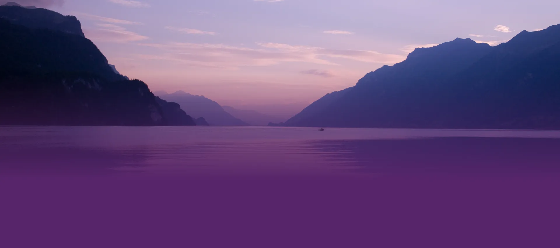 Landscape of a lake between two mountains with a boat